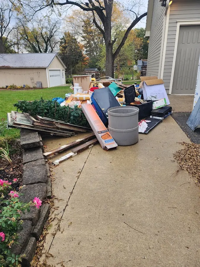Dumpster being loaded with debris for 3 Yard Dumpster Rental in Willard